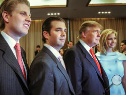 FILE - Donald Trump, chairman and CEO of the Trump Organization, poses with his children, from left, Eric, Donald Jr. and Ivanka, at the opening of the Trump SoHo New York on April 9, 2010. Trump must answer questions under oath in New York state’s civil investigation into his business practices, a judge ruled Thursday, Feb. 17, 2022. Judge Arthur Engoron ordered Trump and his two eldest children, Ivanka and Donald Trump Jr., to comply with subpoenas issued in December by New York Attorney General Letitia J