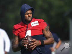 FILE - Texans quarterback Deshaun Watson (4) practices with the team during NFL football practice Monday, Aug. 2, 2021, in Houston. A judge has declined efforts by attorneys for Houston Texans quarterback Deshaun Watson to delay all his depositions in connection with lawsuits filed by 22 women who have accused him of sexual assault and harassment. During a court hearing Monday, Feb. 21, 2022, defense attorney Rusty Hardin asked that depositions be delayed until the end of a criminal investigation. (AP Photo