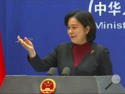 Chinese Foreign Ministry spokesperson Hua Chunying reacts during the daily press conference at the Foreign Ministry in Beijing, Wednesday, Feb. 23, 2022. China on Wednesday accused the U.S. of creating "fear and panic" over the crisis in Ukraine, and called for talks to reduce rapidly building tensions. (AP Photo/Liu Zheng)
