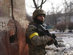 A Ukrainian serviceman guards his position in Mariupol, Ukraine, Saturday, March 12, 2022. Ukraine’s military says Russian forces have captured the eastern outskirts of the besieged city of Mariupol. In a Facebook update Saturday, the military said the capture of Mariupol and Severodonetsk in the east were a priority for Russian forces. Mariupol has been under siege for over a week, with no electricity, gas or water. (AP Photo/Evgeniy Maloletka)