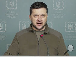 In this image from video provided by the Ukrainian Presidential Press Office and posted on Facebook Tuesday, March 15, 2022, Ukrainian President Volodymyr Zelenskyy speaks in Kyiv, Ukraine. (Ukrainian Presidential Press Office via AP)