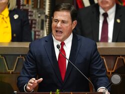 FILE — Arizona Republican Gov. Doug Ducey gives his state of the state address at the Arizona Capitol, Monday, Jan. 10, 2022, in Phoenix. GOP lawmakers thrust Arizona into the national culture wars Thursday, March 24, 2022, when they passed three bills in party-line votes banning abortion after 15 weeks, prohibiting transgender girls from playing on girls sports teams and restricting gender-affirming health care for minors. (AP Photo/Ross D. Franklin, File)