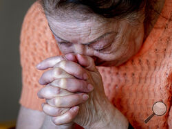 Ukrainian Holocaust survivor Tatyana Zhuravliova reacts during an AP interview in an old people's home in Frankfurt, Germany, Sunday, March 27, 2022. As the war in Ukraine continues to get more brutal, Jewish organizations are trying to evacuate as many of the 10,000 Holocaust survivors living there as possible. (AP Photo/Michael Probst)