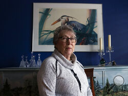 Joyce Ares sits for a portrait in the dinning room of her home on Friday, March 18, 2022, in Canby, Ore. When she turned 74, Ares was feeling fine when she agreed to give a blood sample for research. So she was surprised when the screening test came back positive for signs of cancer. After a repeat blood test, a PET scan and a needle biopsy, she was diagnosed with Hodgkin lymphoma. (AP Photo/Nathan Howard)