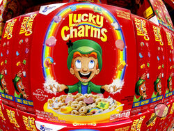 FILE - Boxes of General Mills' Lucky Charms cereal are seen on a shelf at a Costco Warehouse in Robinson Township, Pa., Thursday, May 14, 2020. On Saturday, April 16, 2022, the U.S. Food and Drug Administration said that it is investigating Lucky Charms cereal after dozens of customers complained of illness after eating the product. (AP Photo/Gene J. Puskar, File)