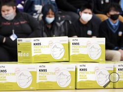 FILE - Boxes of KN95 protective masks are stacked together before being distributed to students at Camden High School in Camden, N.J., Wednesday, Feb. 9, 2022. According to a study by the Centers for Disease Control and Prevention released Tuesday, April 26, 2022, three out of every four U.S. children have been infected with COVID-19.(AP Photo/Matt Rourke, File)
