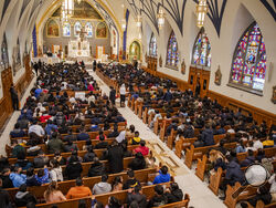 Churchgoers listen to Rev. Manuel Rodriguez preside mass at Our Lady of Sorrows Catholic Church on Sunday, May 8, 2022, in the Queens borough of New York. (AP Photo/Brittainy Newman)