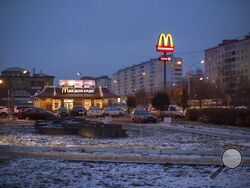 FILE - McDonald's restaurant is seen in the center of Dmitrov, a Russian town 75 km., (47 miles) north from Moscow, Russia, on Dec. 6, 2014. McDonald’s says it's started the process of selling its Russian business, which includes 850 restaurants that employ 62,000 people. The fast food giant pointed to the humanitarian crisis caused by the war, saying holding on to its business in Russia “is no longer tenable, nor is it consistent with McDonald’s values.” The Chicago-based company had temporarily closed its