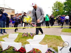 Buffalo Bills' Josh Allen visits the scene of Saturday's shooting at a supermarket, in Buffalo, N.Y., Wednesday, May 18, 2022. (AP Photo/Matt Rourke)