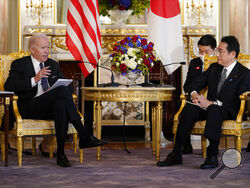 U.S. President Joe Biden, left, talks to Japanese Prime Minister Fumio Kishida during a bilateral meeting at Akasaka Palace, Monday, May 23, 2022, in Tokyo. (AP Photo/Evan Vucci)