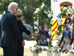 President Joe Biden and first lady Jill Biden visit a memorial at Robb Elementary School to pay their respects to the victims of the mass shooting, Sunday, May 29, 2022, in Uvalde, Texas. (AP Photo/Evan Vucci)