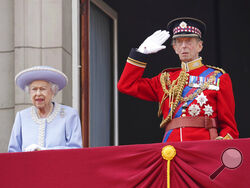 Queen Elizabeth II and the Duke of Kent watch from the balcony of Buckingham Palace after the Trooping the Color ceremony in London, Thursday, June 2, 2022, on the first of four days of celebrations to mark the Platinum Jubilee. The events over a long holiday weekend in the U.K. are meant to celebrate the monarch's 70 years of service. (Jonathan Brady/Pool Photo via AP)