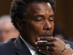 Garnell Whitfield, Jr., of Buffalo, N.Y., whose mother, Ruth Whitfield, was killed in the Buffalo Tops supermarket mass shooting, wipes away tears as he testifies at a Senate Judiciary Committee hearing on domestic terrorism, Tuesday, June 7, 2022, on Capitol Hill in Washington. (AP Photo/Jacquelyn Martin)