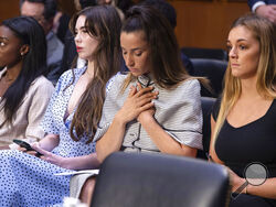 FILE - United States gymnasts from left, Simone Biles, McKayla Maroney, Aly Raisman and Maggie Nichols, arrive to testify during a Senate Judiciary hearing about the Inspector General's report on the FBI's handling of the Larry Nassar investigation on Capitol Hill, Wednesday, Sept. 15, 2021, in Washington. Olympic gold medalist Simone Biles and dozens of other women who say they were sexually assaulted by Larry Nassar are seeking more than $1 billion from the FBI for failing to stop the now convicted sports