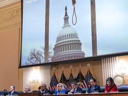 An image of a mock gallows on the grounds of the U.S. Capitol on Jan. 6, 2021, is shown as committee members from left to right, Rep. Adam Schiff, D-Calif., Rep. Zoe Lofgren, D-Calif., Chairman Bennie Thompson, D-Miss., Vice Chair Liz Cheney, R-Wyo., Rep. Adam Kinzinger, R-Ill., Rep. Jamie Raskin, D-Md., and Rep. Elaine Luria, D-Va., look on, as the House select committee investigating the Jan. 6 attack on the U.S. Capitol holds its first public hearing to reveal the findings of a year-long investigation, a