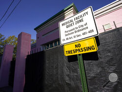 FILE - A sign indicating a "Medical Facility Quiet Zone" is displayed outside the Jackson Women's Health Organization clinic in Jackson, Miss., the state's only state licensed abortion facility, Wednesday, Nov. 18, 2020. According to a report from the Guttmacher Institute released on Tuesday, June 15, 2022, fewer women were getting pregnant and a larger share of them chose abortion. About one in five pregnancies ended in abortion in 2020. There were 3.6 million births, a decline between 2017 and 2020. (AP P