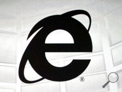 FILE - The Microsoft Internet Explorer logo is projected on a screen during a Microsoft Xbox E3 media briefing in Los Angeles, June 4, 2012. As of Wednesday, June 15, 2022, Microsoft will no longer support the once-dominant browser that legions of web surfers loved to hate and a few still claim to adore. (AP Photo/Damian Dovarganes, File)