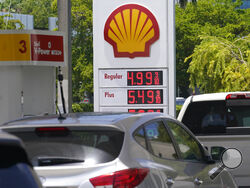 FILES - Cars line up at a Shell gas station June 17, 2022, in Miami. President Joe Biden on June 22 will call on Congress to suspend the federal gasoline and diesel taxes for three months. It's a move meant to ease financial pressures at the pump that also reveals the political toxicity of high gas prices in an election year. (AP Photo/Marta Lavandier, File)