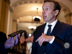 FILE -Sen. Chris Murphy, D-Conn., who has led the Democrats in bipartisan Senate talks to rein in gun violence, pauses for questions from reporters, at the Capitol in Washington, Wednesday, June 22, 2022. The Senate on Thursday, June 23, 2022 easily approved a bipartisan gun violence bill that seemed unthinkable just a month ago, clearing the way for final congressional approval of what will be lawmakers' most far-reaching response in decades to the nation's run of brutal mass shootings. (AP Photo/J. Scott 