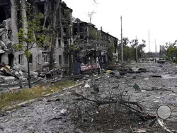 In this photo provided by the Luhansk region military administration, damaged residential buildings are seen in Lysychansk, Luhansk region, Ukraine, early Sunday, July 3, 2022. Russian forces pounded the city of Lysychansk and its surroundings in an all-out attempt to seize the last stronghold of resistance in eastern Ukraine's Luhansk province, the governor said Saturday. A presidential adviser said its fate would be decided within the next two days. (Luhansk region military administration via AP)