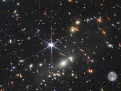 This image provided by NASA on Monday, July 11, 2022, shows galaxy cluster SMACS 0723, captured by the James Webb Space Telescope. The telescope is designed to peer back so far that scientists can get a glimpse of the dawn of the universe about 13.7 billion years ago and zoom in on closer cosmic objects, even our own solar system, with sharper focus. (NASA/ESA/CSA/STScI via AP)