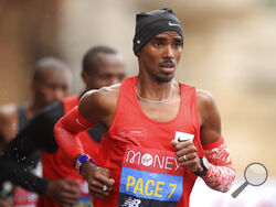 FILE - Britain's Mo Farah, right, runs as a pacemaker during the London Marathon in London, England, Oct. 4, 2020. Four-time Olympic champion Farah has disclosed he was brought into Britain illegally from Djibouti under the name of another child. “The truth is I’m not who you think I am," the 39-year-old Farah told the BBC in a documentary called “The Real Mo Farah.” (Adam Davy/Pool via AP, File)