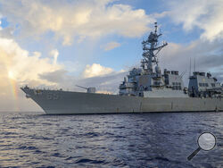 In this photo provided by U.S. Navy, Arleigh Burke-class guided-missile destroyer USS Benfold (DDG 65) conducts routine underway operations in the Philippines Sea on June 24, 2022. The U.S. Navy on Wednesday, July 13, 2022, sailed the destroyer close to China-controlled islands in the South China Sea in what Washington said was a patrol aimed at asserting freedom of navigation through the strategic seaway. (Mass Communication Specialist 2nd Class Arthur Rosen/U.S. Navy via AP)