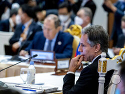 Secretary of State Antony Blinken, right, and Russian Foreign Minister Sergey Lavrov, left, are seated close together during an east Asia summit foreign ministers meeting at Sokha Hotel in Phnom Penh, Cambodia, Friday, Aug. 5, 2022. Blinken is on a ten day trip to Cambodia, Philippians, South Africa, Congo, and Rwanda. (AP Photo/Andrew Harnik, Pool)