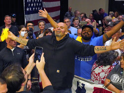 Pennsylvania Lt. Gov. John Fetterman, the Democratic nominee for the state's U.S. Senate seat, center, poses for a photo with supporters after speaking at a rally in Erie, Pa., on Friday, Aug. 12, 2022. (AP Photo/Gene J. Puskar)