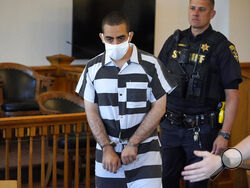 Hadi Matar, 24, center, arrives for an arraignment in the Chautauqua County Courthouse in Mayville, N.Y., Saturday, Aug. 13, 2022. Matar, who is accused of carrying out a stabbing attack against “Satanic Verses” author Salman Rushdie has entered a not-guilty plea in a New York court on charges of attempted murder and assault. An attorney for Matar entered the plea on his behalf during an arraignment hearing. (AP Photo/Gene J. Puskar)