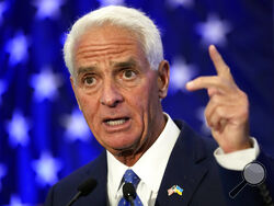 Rep Charlie Crist, D-Fla., gestures after declaring victory Tuesday, Aug. 23, 2022, in St. Petersburg, Fla. Crist defeated Agriculture Commissioner Nikki Fried in the Democratic gubernatorial primary election and will face incumbent Republican Gov. Ron DeSantis in November. (AP Photo/Chris O'Meara)