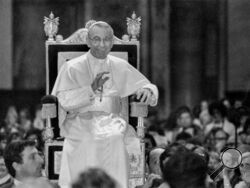Pope John Paul I smiles and waves as he is carried on a portable throne during his weekly general audience at The Vatican, Wednesday, Sept. 27, 1978. This is the last public appearance of Pope John Paul I. He died in the early morning of Sept. 28 in Rome. On Sunday, Sept. 4, 2022, Pope Francis will beatify John Paul I, the last formal step before on the path to possible sainthood. (AP Photo/Bruno Mosconi)