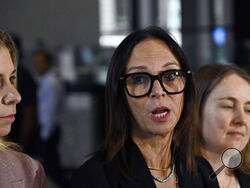 R. Kelly's defense attorneys, Jennifer Bonjean, center, Ashley Cohen, left and Diane O'Connell, speak at the Dirksen Federal Courthouse in Chicago after verdicts were reached in R. Kelly's trial, Wednesday, Sept. 14, 2022, in Chicago. A federal jury on Wednesday convicted R. Kelly of several child pornography and sex abuse charges in his hometown of Chicago, delivering another legal blow to a singer who used to be one of the biggest R&B stars in the world. (AP Photo/Matt Marton)