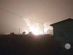 In an image taken from video, flames and smoke rise from a military airbase Wednesday, Oct. 5, 2022, in Gangnueng, South Korea. South Korea’s Joint Chiefs of Staff said no injuries were reported from the explosion which involved a short-range Hyumoo-2 missile. (Kim Hee Soo via AP)