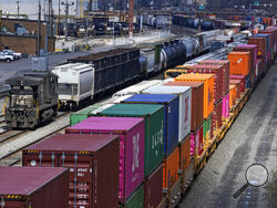 FILE - Freight train cars and containers at Norfolk Southern Railroad's Conway Yard in Conway, Pa., April 2, 2021. President Joe Biden's call for Congress to intervene in the railroad contract dispute undercuts the unions' efforts to address workers' quality of life concerns, but businesses stress that it is crucial to avoid a strike that would devastate the economy. (AP Photo/Gene J. Puskar, File)