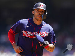 FILE - Minnesota Twins' Carlos Correa rounds third base during a baseball game against the Los Angeles Angels Sunday, Aug. 14, 2022, in Anaheim, Calif. In a wild twist overnight, Carlos Correa agreed to a $315 million, 12-year contract with the free-spending New York Mets after his pending deal with the San Francisco Giants came apart over an issue with his physical. (AP Photo/Marcio Jose Sanchez, File)