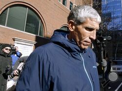 FILE - William "Rick" Singer founder of the Edge College & Career Network, departs federal court in Boston, on March 12, 2019. The mastermind of the nationwide college admissions bribery scandal is set to be sentenced on Wednesday, Jan. 4, 2023, after helping authorities secure the convictions of a slew of wealthy parents involved in his scheme to rig the selection process at top-tier schools. (AP Photo/Steven Senne, File)