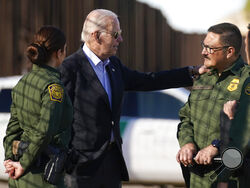 President Joe Biden talks with U.S. Border Patrol agents as they stand along a stretch of the U.S.-Mexico border in El Paso Texas, Sunday, Jan. 8, 2023. (AP Photo/Andrew Harnik)