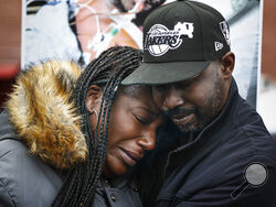 Kenyana Dixon is comforted during a rally for her brother Tyre Nichols at the National Civil Rights Museum on Monday, Jan. 16, 2023. Nichols was killed during a traffic stop with Memphis Police on Jan. 7. (Mark Weber/Daily Memphian via AP)