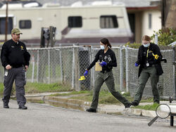 Tulare County Sheriff crime unit investigates the scene of a shooting, Monday, Jan. 16, 2023 in Goshen, Calif. Authorities are searching for at least two suspects who shot and killed six people — including a teenage mother and her baby — at a central California home Monday in what the local sheriff called a “horrific massacre” related to drugs and gangs. (Gary Coronado/Los Angeles Times via AP)