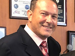 This portion of a photo posted on Twitter by the DEA's New York division on Aug 30, 2019 shows Nicholas Palmeri. The U.S. Drug Enforcement Administration quietly removed Palmeri, its top official in Mexico, in 2022 over improper contact with lawyers for narcotraffickers, an embarrassing end to a brief tenure marked by deteriorating cooperation between the countries and a record flow of cocaine, heroin and fentanyl across the border. (DEA via AP)