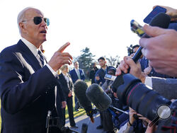 President Joe Biden talks with reporters on the South Lawn of the White House in Washington, Monday, Jan. 30, 2023, after returning from an event in Baltimore on infrastructure. (AP Photo/Susan Walsh)