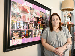 Jessica Day-Weaver poses next to a picture collage made for her daughter, Anastasia, at her home, Thursday, Feb. 2, 2022, in Boardman, Ohio. (AP Photo/Nick Cammett)