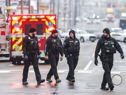 Law enforcement personnel work at the scene of a shooting at a Tennessee library, Thursday, Feb. 2, 2023, in Memphis. Authorities say one person is dead and a police officer was critically wounded. (Patrick Lantrip/Daily Memphian via AP)