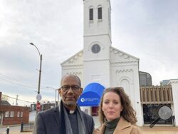 The Rev. Darryl Gray and the Rev. Lauren Bennett stand in front of Bennett's church, Metropolitan Community Church of Greater St. Louis, on Jan. 10, 2023, in St. Louis, Mo. Both served as spiritual advisers at recent executions in Missouri, sitting alongside the inmates and touching them as the process occurred. Spiritual advisers have been increasingly present during executions since a Supreme Court ruling last year. (AP Photo/Jim Salter)