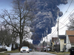 A black plume rises over East Palestine, Ohio, as a result of a controlled detonation of a portion of the derailed Norfolk and Southern trains Monday, Feb. 6, 2023. (AP Photo/Gene J. Puskar)