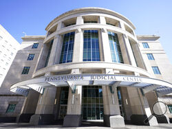 FILE - The exterior of the Pennsylvania Judicial Center, home to the Commonwealth Court in Harrisburg, Pa., is pictured on Nov. 6, 2020. A Pennsylvania judge ruled Tuesday, Feb. 7, 2023, that the state's funding of public education falls woefully short, siding with poorer districts in a lawsuit that was first filed eight years ago. (AP Photo/Julio Cortez, File)