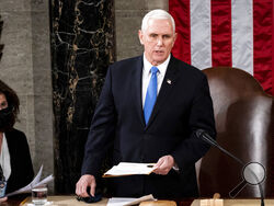 FILE - Vice President Mike Pence officiates as a joint session of the House and Senate convenes to confirm the Electoral College votes cast in November's election, at the Capitol in Washington, Wednesday, Jan. 6, 2021. Former Vice President Mike Pence has been subpoenaed by the special counsel overseeing investigations into efforts by former President Donald Trump and his allies to overturn the results of the 2020 election, Thursday, Feb. 9, 2023. (Erin Schaff/The New York Times via AP, Pool, File)