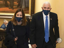 FILE - In this image from video released by the House Select Committee, Vice President Mike Pence and his wife Karen walk at the Capitol on Jan 6, that the House select committee investigating the Jan. 6 attack on the U.S. Capitol displayed June 16, 2022, on Capitol Hill in Washington. The subpoena to former Vice President Mike Pence is a milestone moment in an ongoing Justice Department special counsel investigation. But it doesn't guarantee he's going to be testifying before a grand jury anytime soon. (Ho