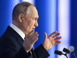 Russian President Vladimir Putin gestures as he gives his annual state of the nation address in Moscow, Russia, Tuesday, Feb. 21, 2023. (Mikhail Metzel, Sputnik, Kremlin Pool Photo via AP)